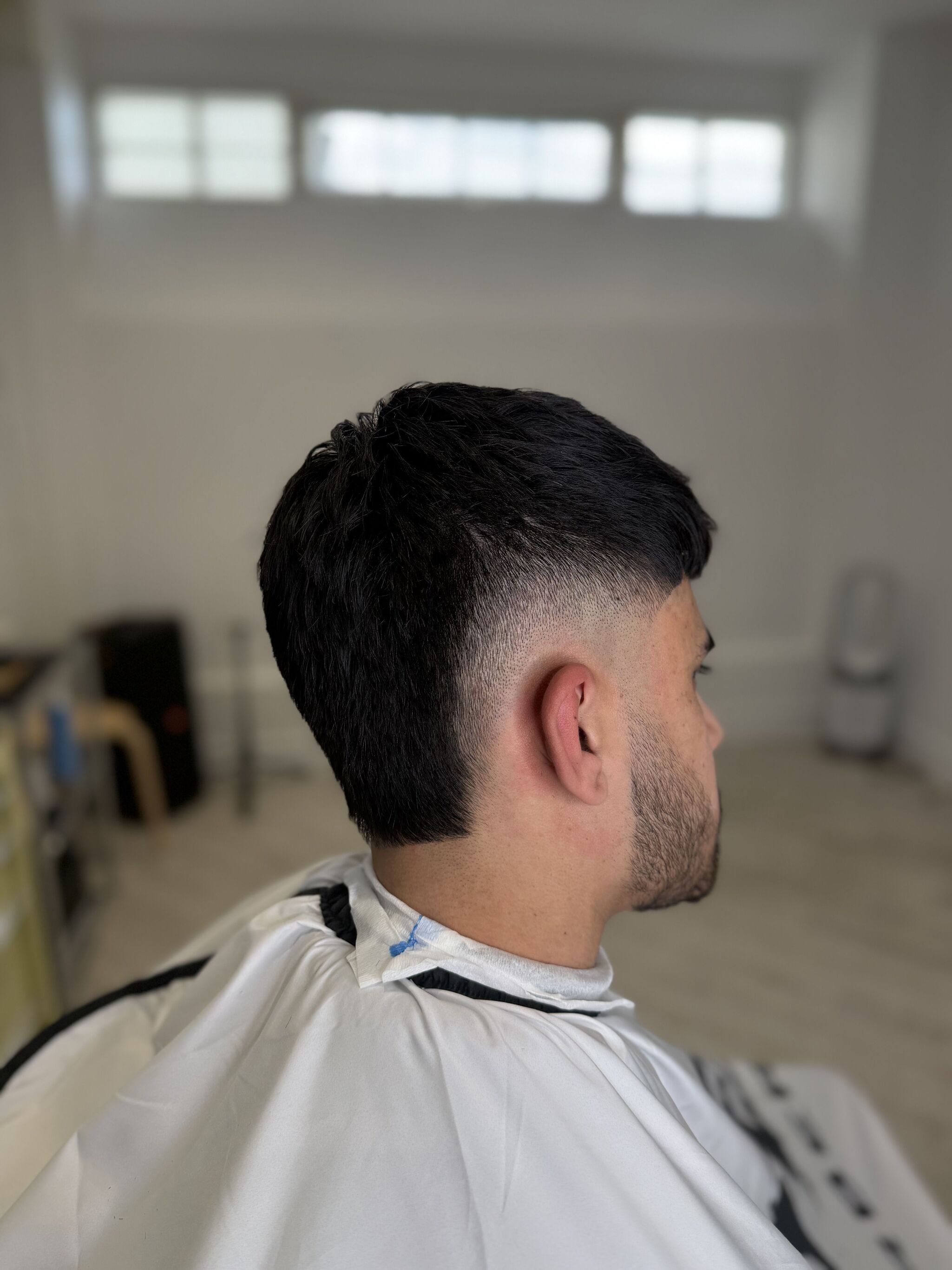 Dark mullet with a burst fade